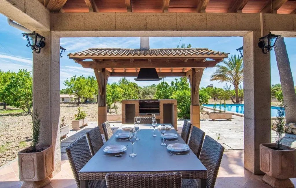 Covered terrace dining area with BBQ