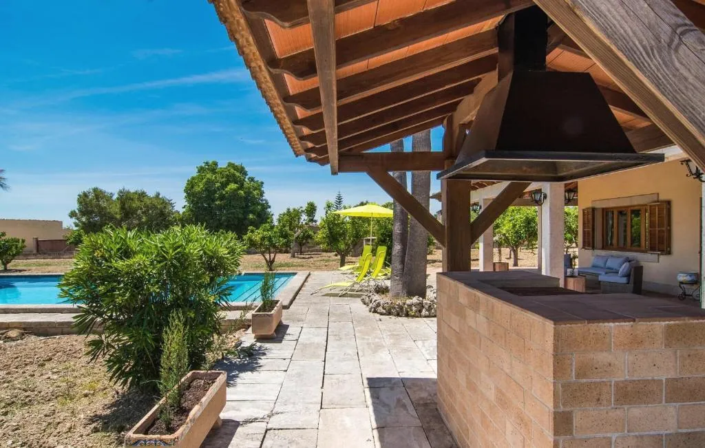 Outdoor BBQ terrace with the pool in view