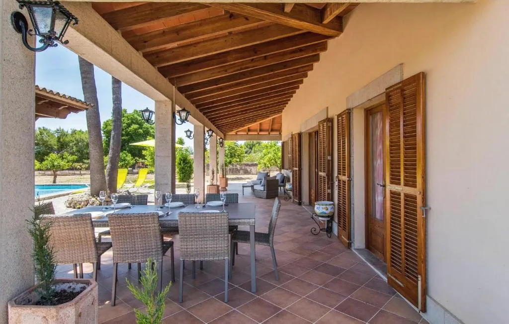 Outdoor dining terrace overlooking the pool