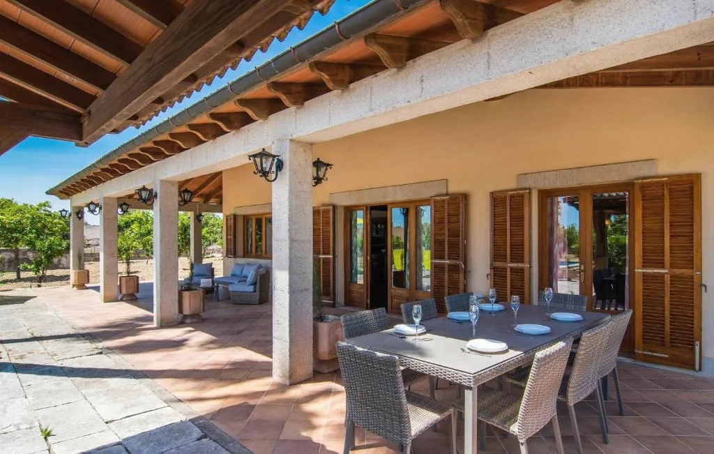 Terrace dining area beside traditional shutters